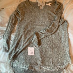 Light sweater size Large. Never worn.